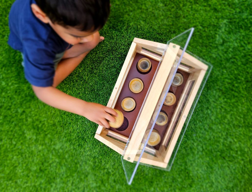small wooden greenhouse