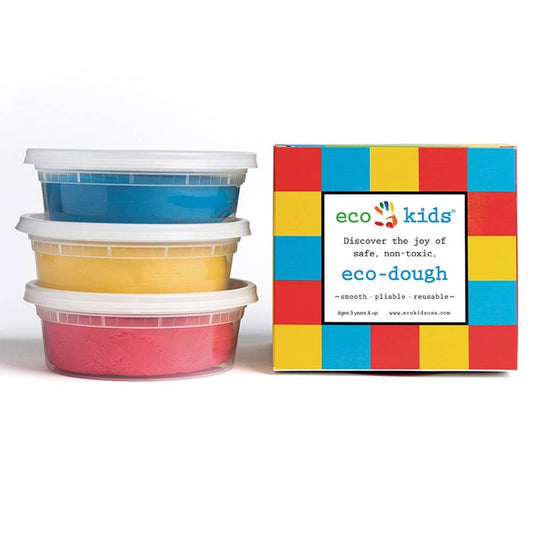 Three containers of playdough in red, blue, and yellow colors, stacked together next to a colorful box labeled 'eco-kids' with the text 'Discover the joy of safe, non-toxic eco-dough'.